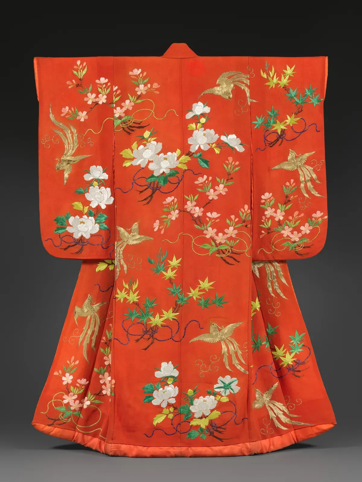 Red furisode kimono with long swinging sleeves, embroidered with phoenixes, cherry blossoms, peonies and maple leaves